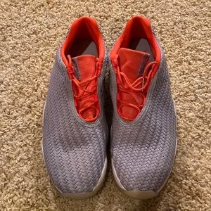 Nike jordans size 10.  silver in color with coral colored tongue/laces